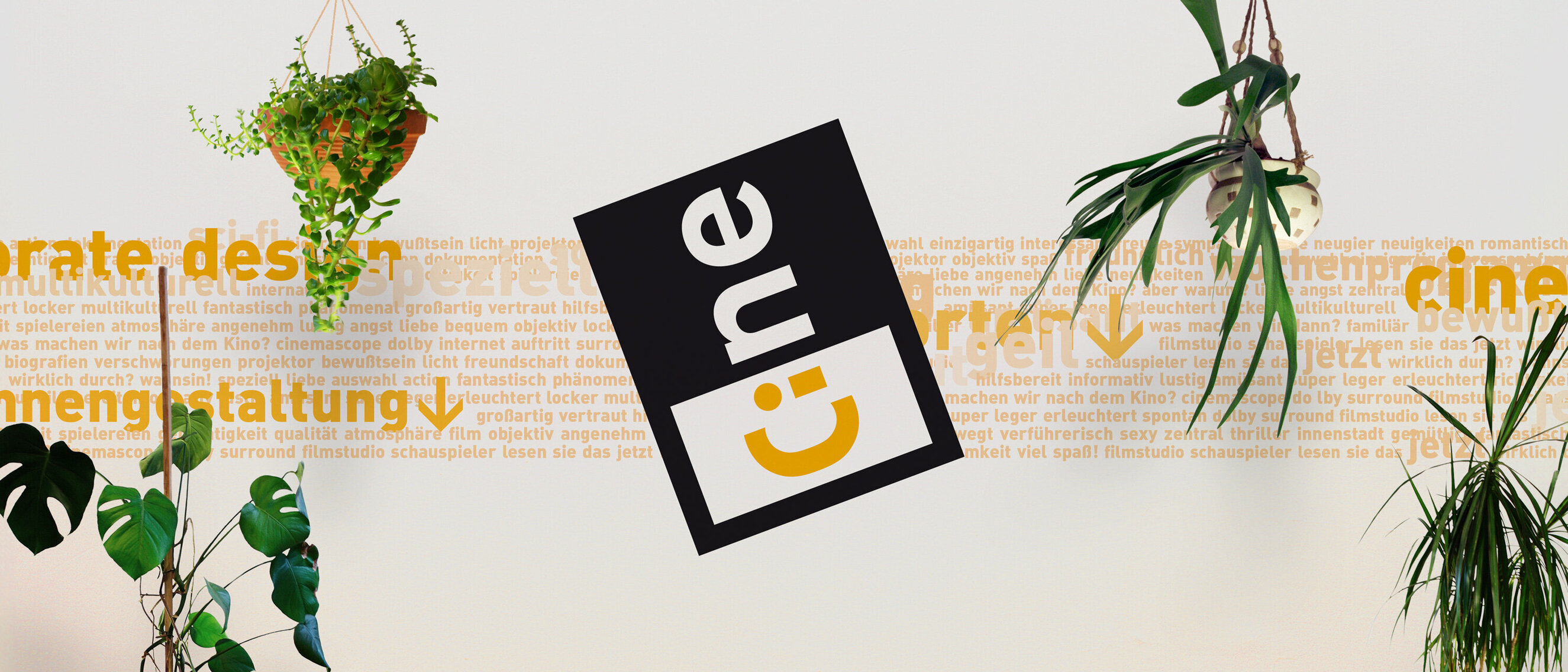 CINE CENTER: Branding and Corporate Identity
   
    
        
            CINE cinema's welcoming logo overlapping a typographic guidance system on a wall, invoking a home-like setting.
